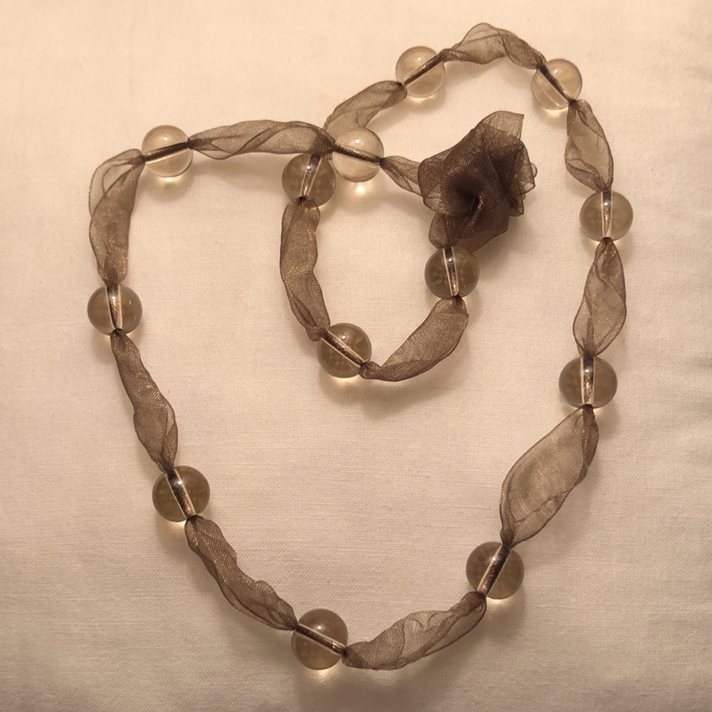 Sage green ribbon with clear beads.